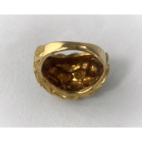 387 - A 9 carat hallmarked gold modernist ring in the form of a cluster of leaves, 6.8 gm size 'J'