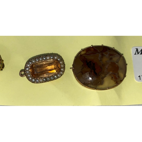 397 - A Victorian brooch set oval amber coloured faceted stone; another brooch set amber coloured rectangu... 