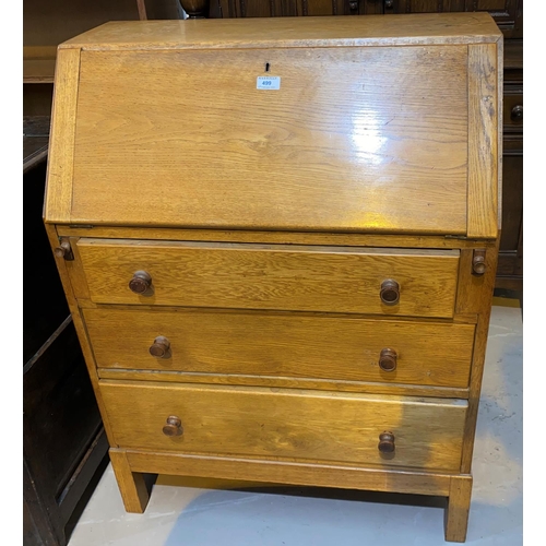 499 - A mid 20th century oak bureau with fall font and 3 drawers, width 76 cm