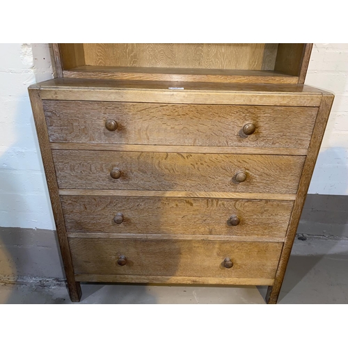 500 - A 1930's limed oak 4 height chest of drawers with bookcase top, by Heals, height 158cm x length 76cm... 