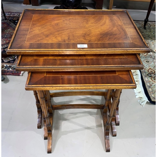 553 - A nest of 3 trio tables in crossbanded mahogany