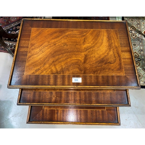 553 - A nest of 3 trio tables in crossbanded mahogany