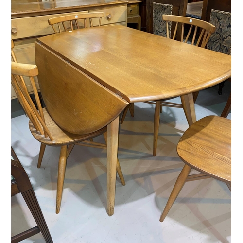 603 - A 1960's Ercol light elm dining suite comprising drop leaf circular table, 5 stick back chairs and s... 