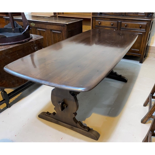 605 - An Ercol buffet sideboard; a refectory dining table with rectangular top