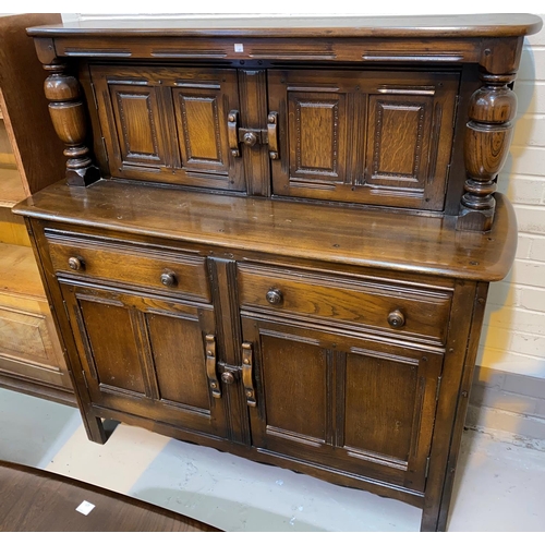 605 - An Ercol buffet sideboard; a refectory dining table with rectangular top