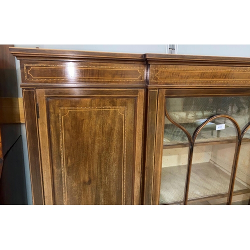 619 - An Edwardian inlaid mahogany display cabinet in the Sheraton style with central glazed and 2 panelle... 