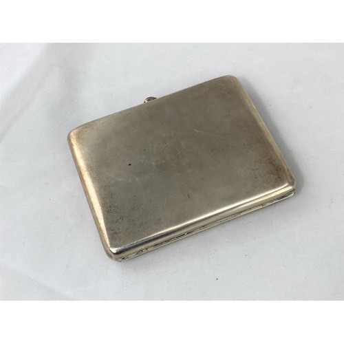 255 - A Russian white metal cigarette case stamped '875' with a head mark to interior, red cabochon stone ... 