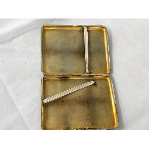 255 - A Russian white metal cigarette case stamped '875' with a head mark to interior, red cabochon stone ... 