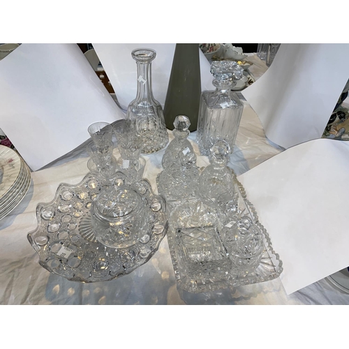 222 - A cut glass table lamp; 2 decanters; glassware