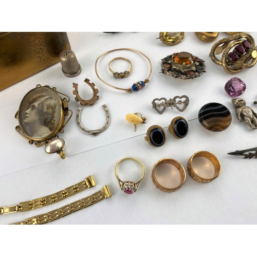 369 - A selection of Victorian and later costume jewellery:  bangles; lockets; brooches; etc.