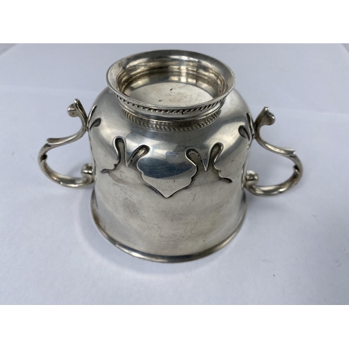 408 - A porringer with relief decoration to lower body and circular gadrooned foot, Birmingham 1921, 9.5oz... 