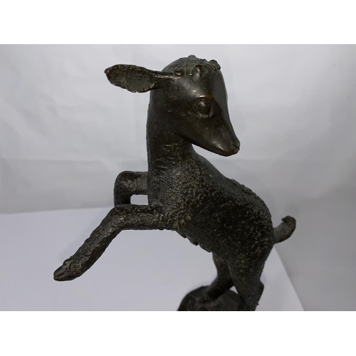 446 - A bronze 'animalier' figure of a leaping lamb, on polished stone base, 29 cm overall