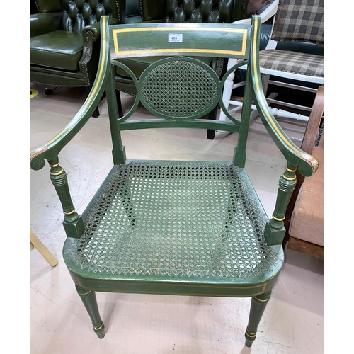 485 - A Regency style armchair with cane back, the seat in green and gilt finish