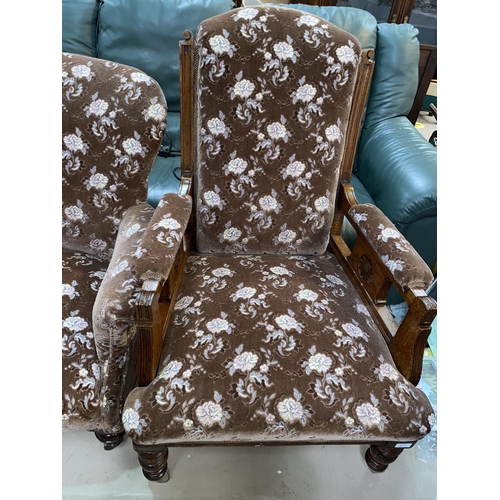 617 - A Victorian armchair in embossed floral fabric with high back