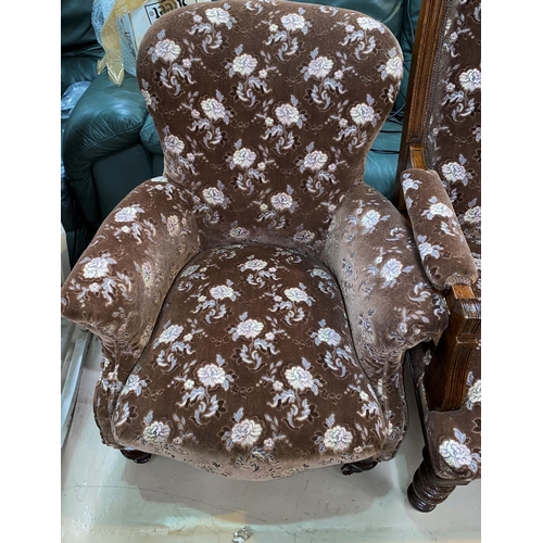 617 - A Victorian armchair in embossed floral fabric with high back