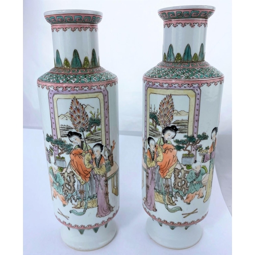 160 - A pair of Chinese ceramic rouleau vases decorated with traditional family scenes, hand painted with ... 