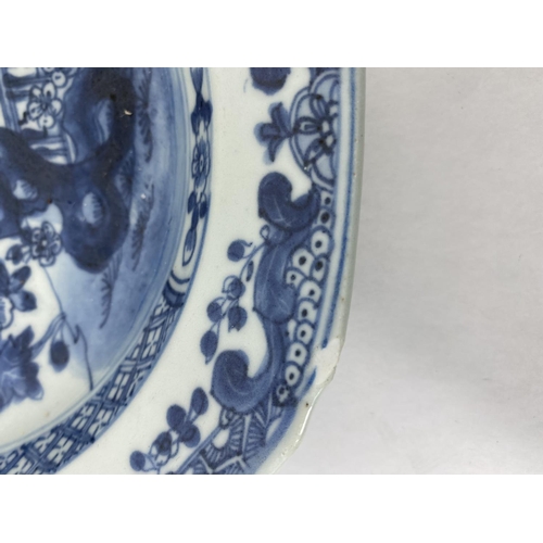 162 - A Chinese blue and white octagonal dish decorated with trees and plants, 23cm; a similar Chinese blu... 