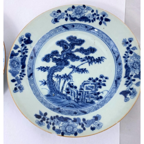 164 - Two Chinese blue and white plates decorated with trees, diameter 23cm