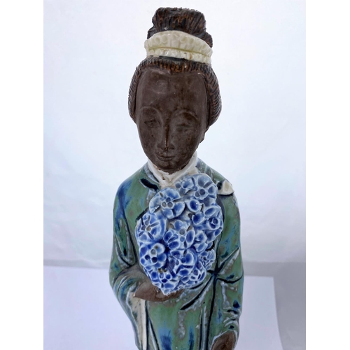 165 - A Chinese ceramic figure of woman in robed and flowers, mounted on velvet stand, height 35cm and Chi... 