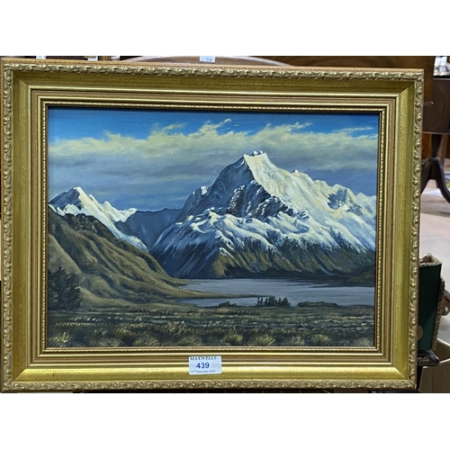 439 - A mountainous landscape with snowy caps and a lake below (possible Mount Cook in New Zealand) oil, s... 