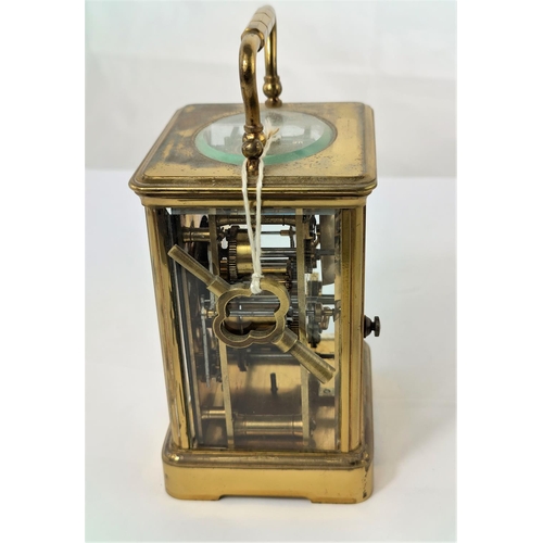 463 - A late 19th/early 20th century brass carriage clock with white enamel dial and timepiece movement wi... 