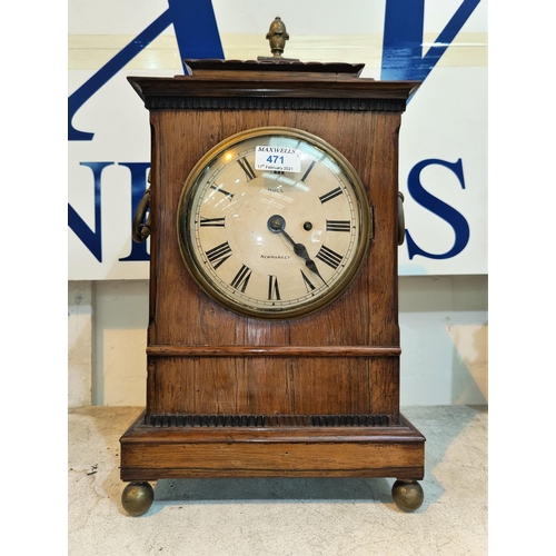 471 - A late Georgian bracket clock in rosewood case with brass finial, ring handles and ball feet, circul... 