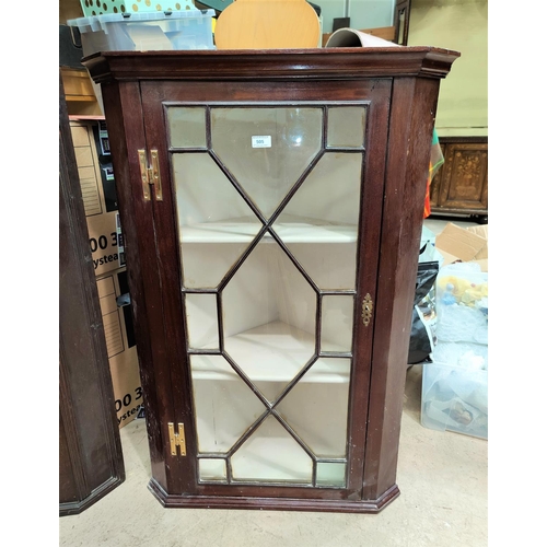 505 - A 19th century mahogany corner cupboard with straight front, enclosed by astragal glazed door