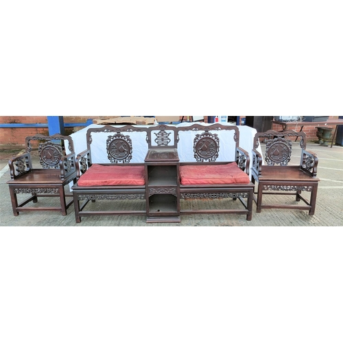 542 - A late 19th century Chinese 3-piece drawing room suite with extensive carved and pierced decoration ... 