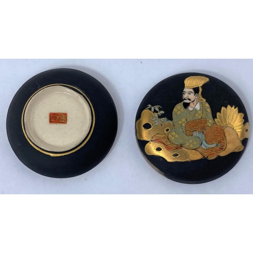 137A - A Japanese satsuma miniature circular ceramic lidded pot decorated with traditional dressed man with... 