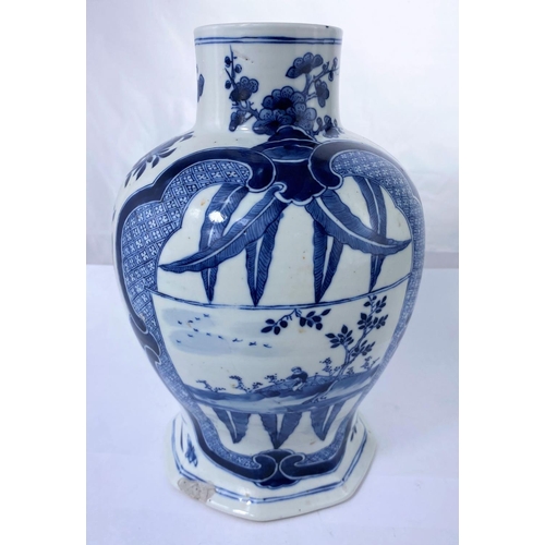 140A - A Chinese blue and whiter baluster vase with octagonal base decorated with traditional scenes, six c... 