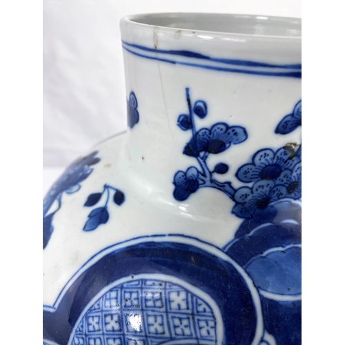 140A - A Chinese blue and whiter baluster vase with octagonal base decorated with traditional scenes, six c... 