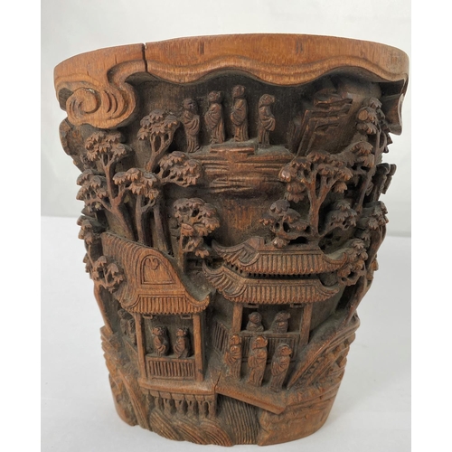 187 - A 19th century Chinese extensively carved bamboo brush pot with temples, trees, figures, height 17.5... 