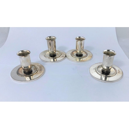 336 - A continental set of 4 silver dwarf candlesticks on wide circular bases, import marks for 1969, 12 o... 