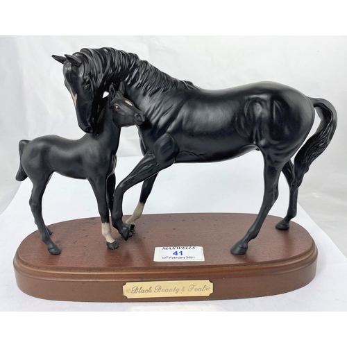 41 - A Royal Doulton ceramic group Black Beauty and foal on wooden base