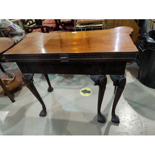 493 - An early/mid Georgian mahogany card table with triple folding top and outset rounded corners, frieze... 