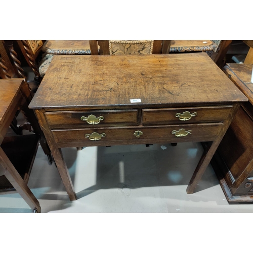 495 - A Georgian country made occasional table in crossbanded oak, 2 frieze drawers with brass swan neck h... 