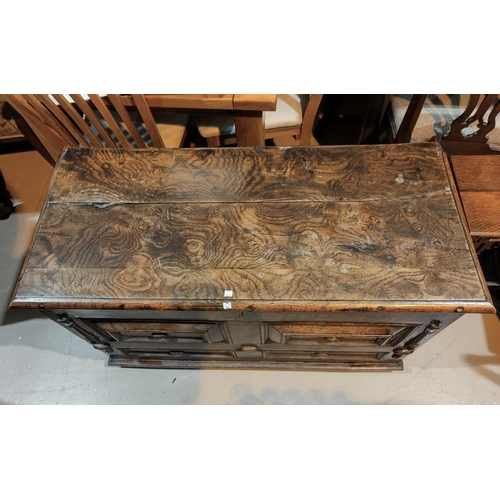 496A - A 19th century oak blanket box in the William & Mary style, with hinged lid and geometric moulded de... 