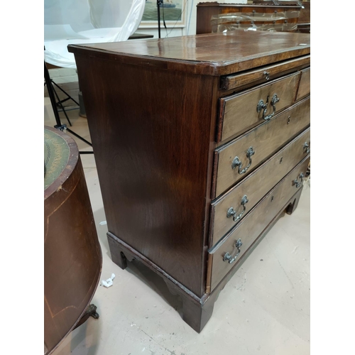 504a - A Georgian mahogany bachelors chest of 3 long and 2 short drawers, with brushing slide and brass orn... 