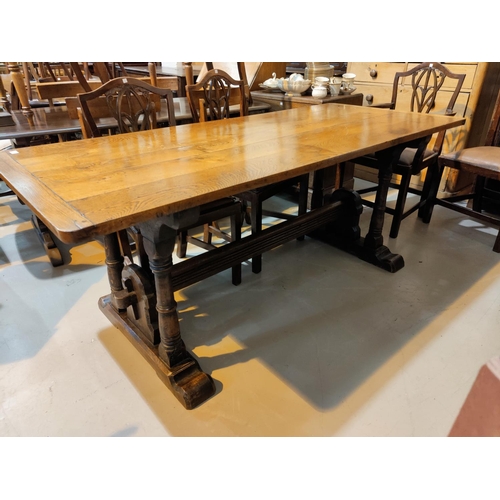 508 - A late 19th early 20th century refectory dining table with a medieval style base with ring turned le... 