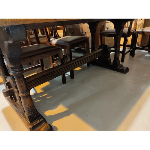 508 - A late 19th early 20th century refectory dining table with a medieval style base with ring turned le... 