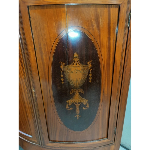 521 - An Edwardian Sheraton style satinwood corner display cabinet with pierced fretwork cornice, 2 glazed... 