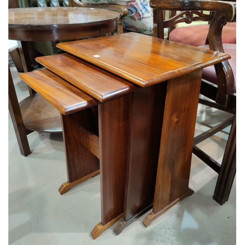 593 - A mahogany nest of 3 occasional tables; a mahogany circular occasional table of 2 tiers