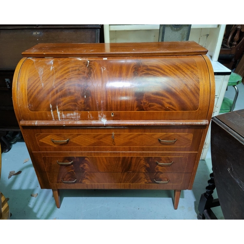 665 - A reproduction mahogany cylinder bureau with 3 drawers underneath, surface stained