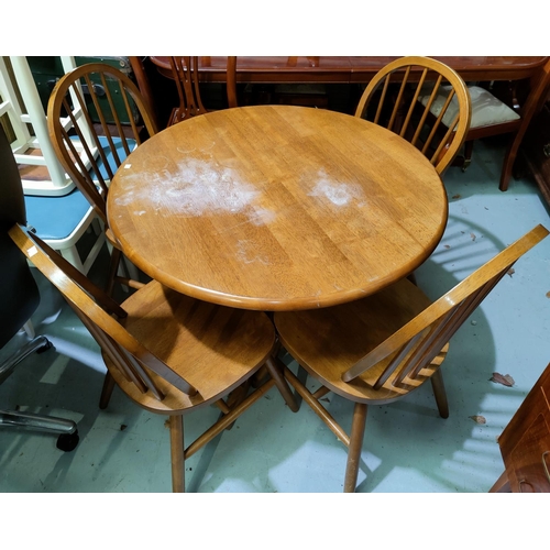 666 - A breakfast set comprising circular pedestal table and 4 hoop back chairs