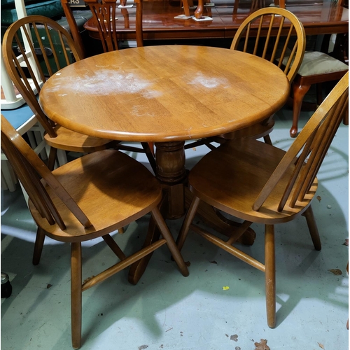 666 - A breakfast set comprising circular pedestal table and 4 hoop back chairs