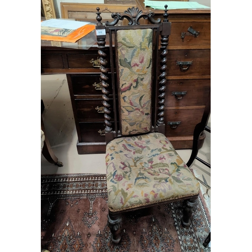 512 - A Victorian walnut occasional chair with high back and barley twist side columns, on turned legs, ne... 