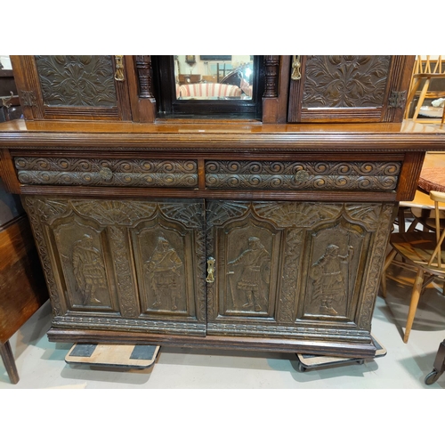 530 - An Edwardian buffet sideboard with carved decoration comprising 2 cupboards over 2 drawers and doubl... 