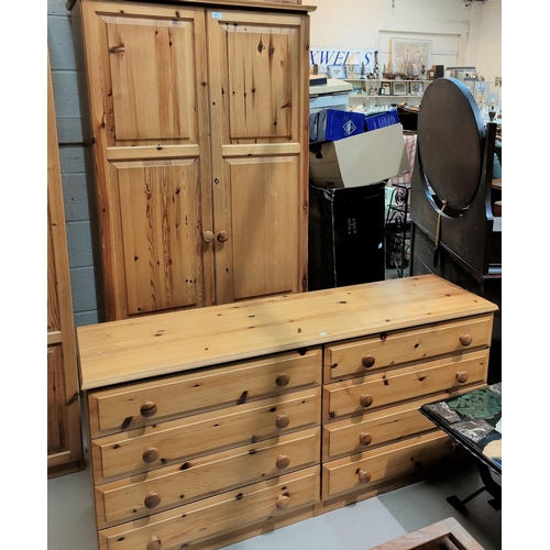 551 - A modern pine 3 piece bedroom suite comprising double door wardrobe, side by side chest of 8 drawers... 