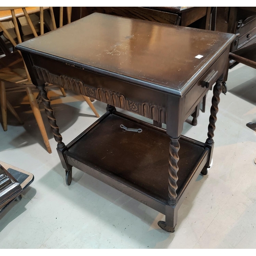 581 - An Edwardian bedside cabinet in scumbled finish; 2 oak framed wall mirrors; a 2 tier oak tea trolley... 