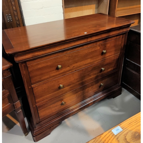 599 - A near matching bedroom suite comprising kneehole dressing table, mirror, chair and 3 height chest o... 